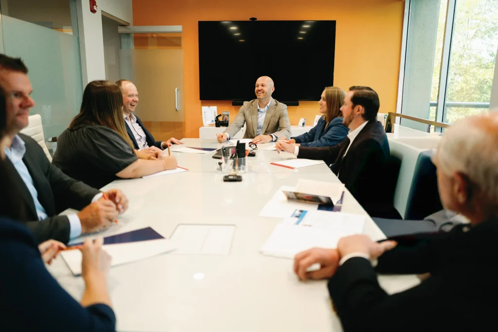 Butson Financial Advisors, LLC sitting at a conference table in the office